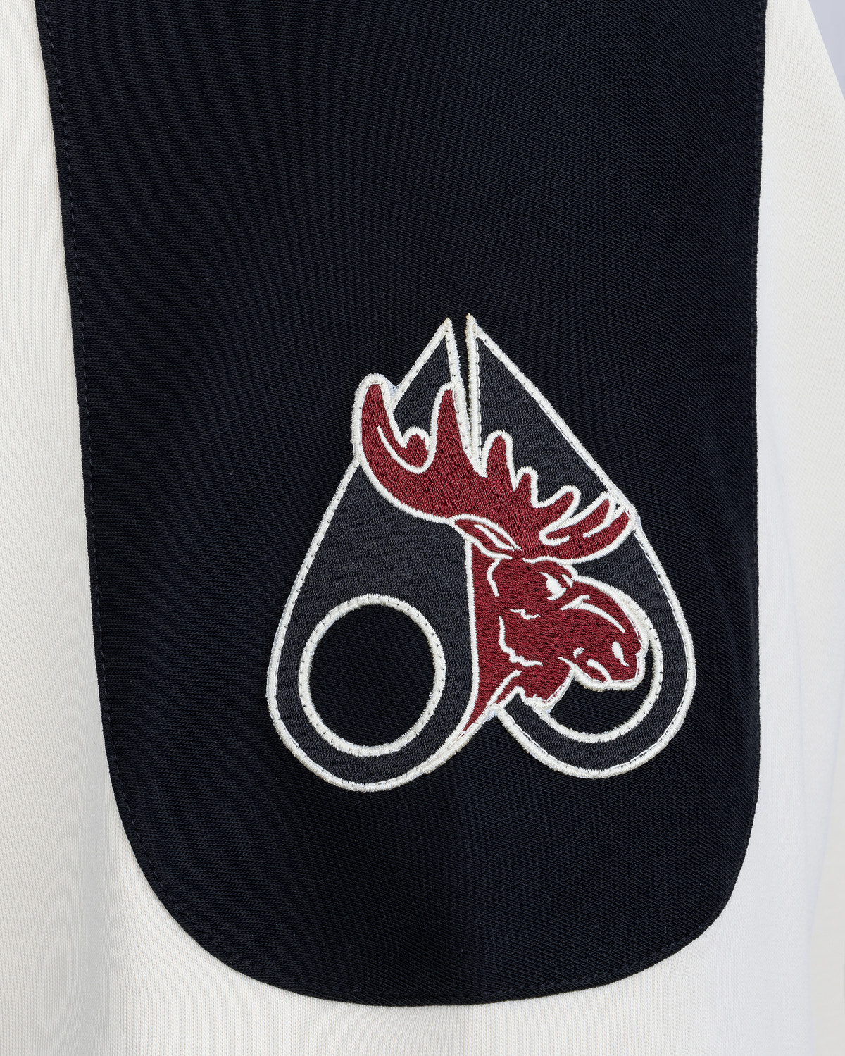 NHL X MOOSE KNUCKLES TEAM POLO-BLACK/SUMAC/BONE